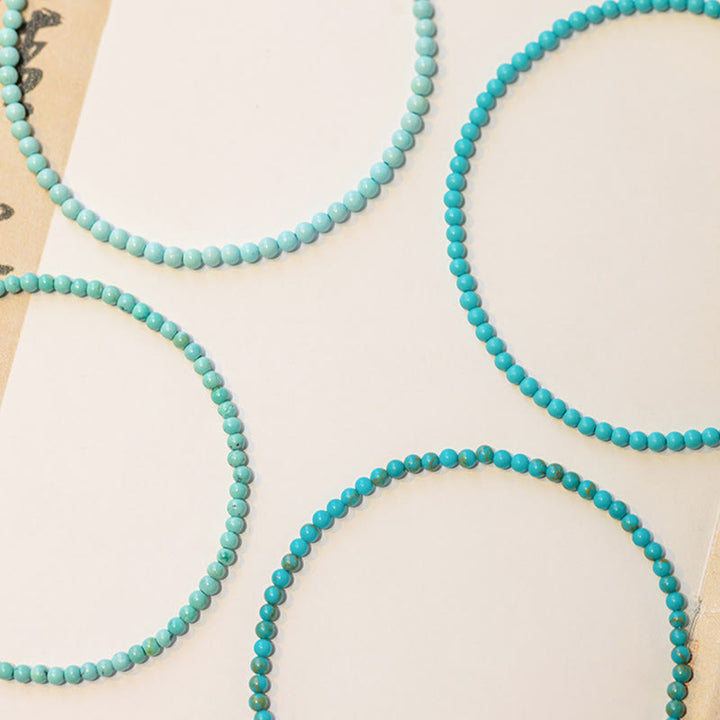 Braccialetto della saggezza in rame placcato oro 14k con perline ultrasottili color turchese da 2 mm Buddha Stones
