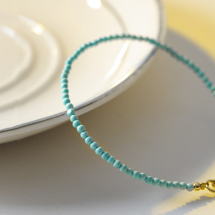 Braccialetto della saggezza in rame placcato oro 14k con perline ultrasottili color turchese da 2 mm Buddha Stones