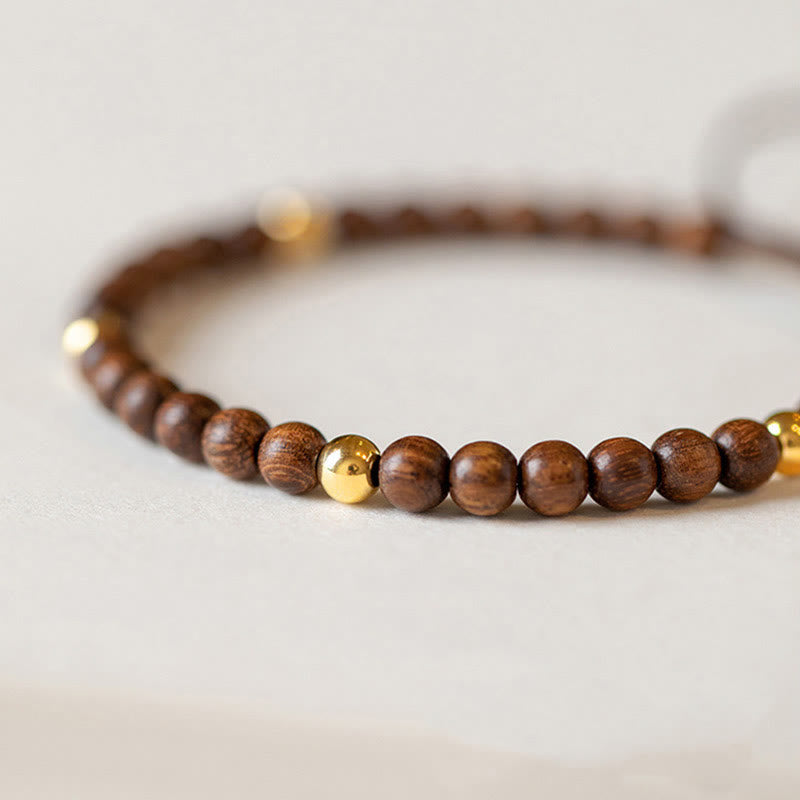 Braccialetto di protezione con perline di rame placcate in oro 14K e legno di sandalo ultrasottile da 4 mm Buddha Stones