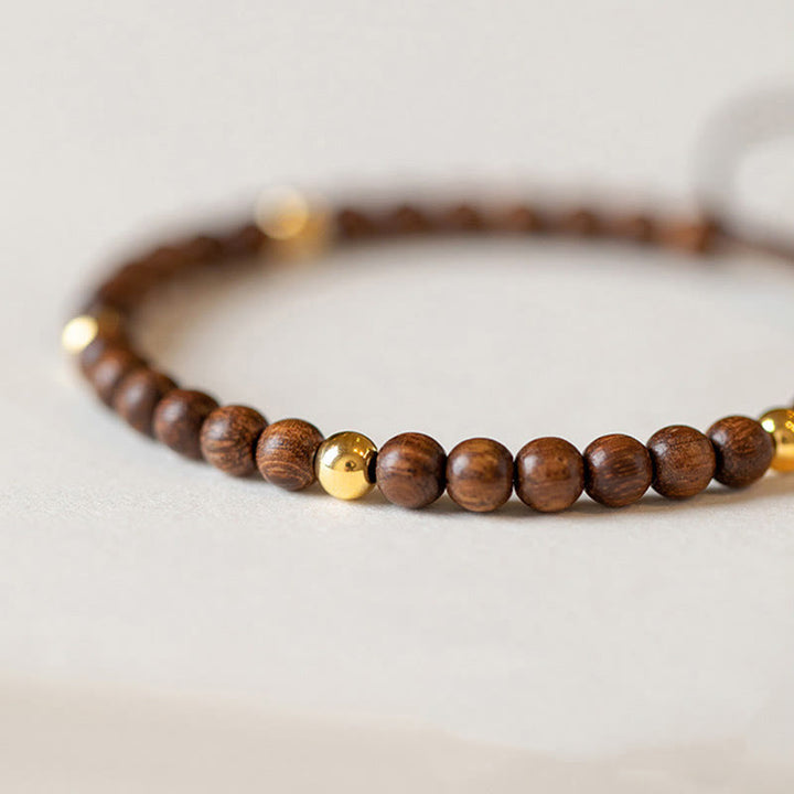 Braccialetto di protezione con perline di rame placcate in oro 14K e legno di sandalo ultrasottile da 4 mm Buddha Stones