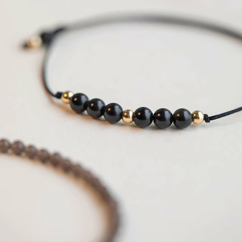 Braccialetto di successo con perline ultrasottili in quarzo fumé e ossidiana nera Buddha Stones