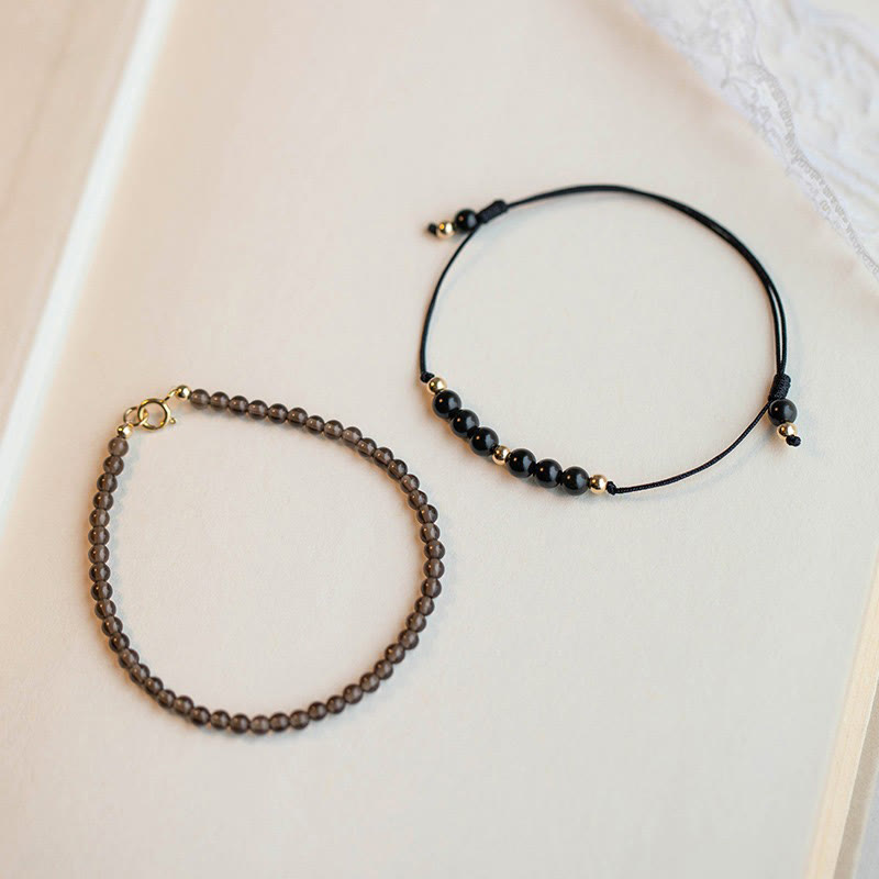 Braccialetto di successo con perline ultrasottili in quarzo fumé e ossidiana nera Buddha Stones