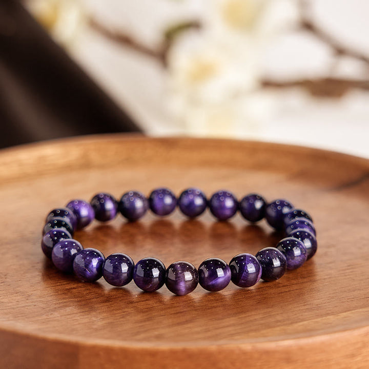 Braccialetto della creatività con occhio di tigre viola Buddha Stones