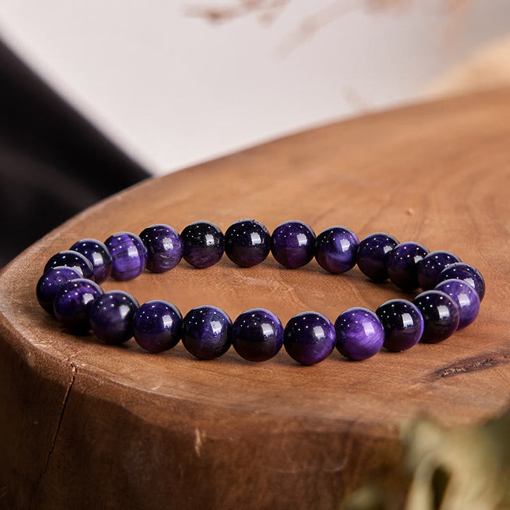 Braccialetto della creatività con occhio di tigre viola Buddha Stones