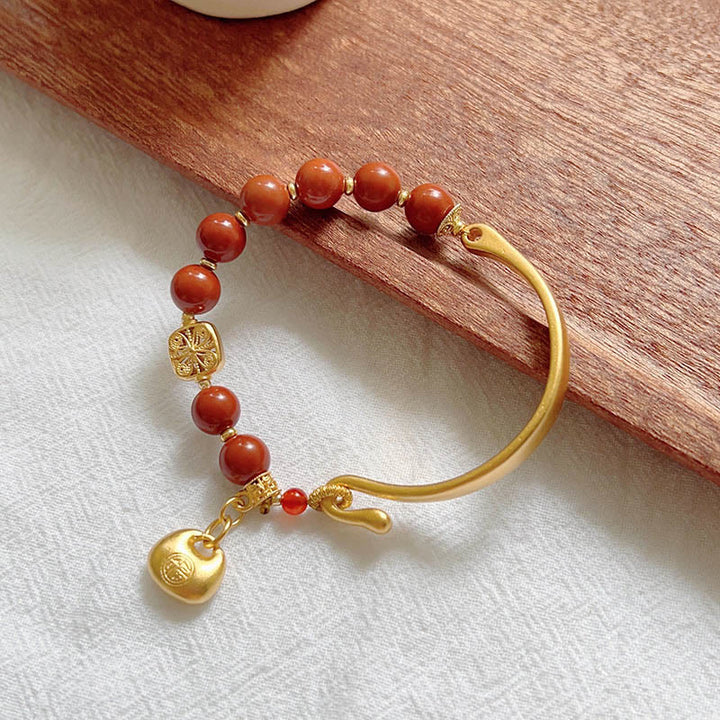 Braccialetto a mezzo lingotto con carattere Fu in agata rossa del sud Buddha Stones
