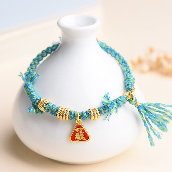 Braccialetto di protezione con nappa di fiori in corda tibetana con Buddha Stones , Zakiram, dea della ricchezza