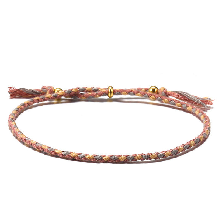 Braccialetto dell'armonia regolabile con nappa intrecciata in corda colorata fatta a mano di Buddha Stones