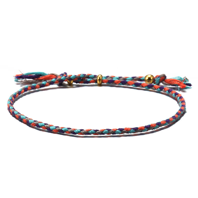 Braccialetto dell'armonia regolabile con nappa intrecciata in corda colorata fatta a mano di Buddha Stones