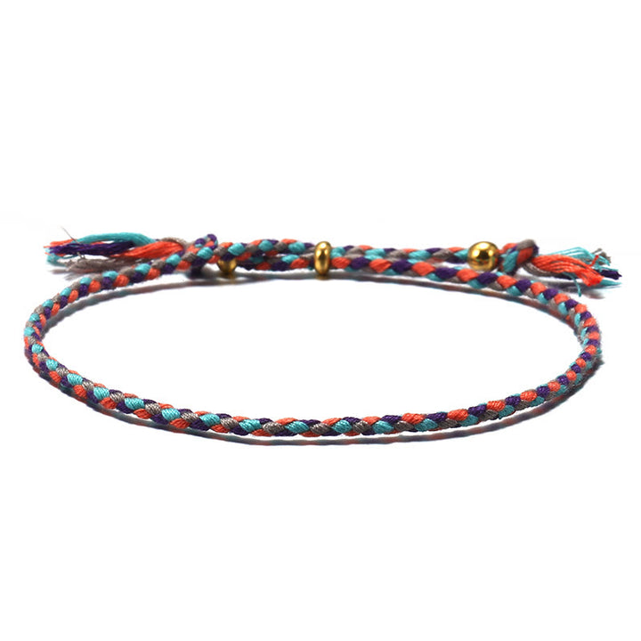 Braccialetto dell'armonia regolabile con nappa intrecciata in corda colorata fatta a mano di Buddha Stones