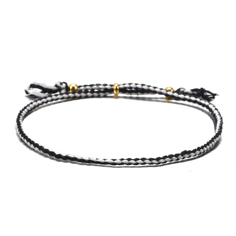 Braccialetto dell'armonia regolabile con nappa intrecciata in corda colorata fatta a mano di Buddha Stones