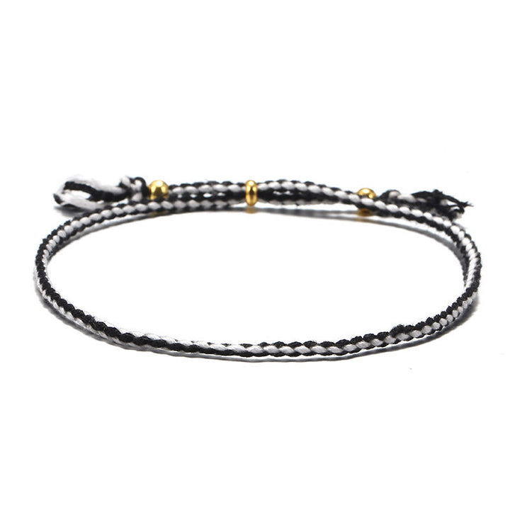 Braccialetto dell'armonia regolabile con nappa intrecciata in corda colorata fatta a mano di Buddha Stones