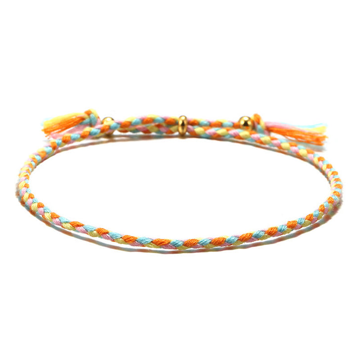 Braccialetto dell'armonia regolabile con nappa intrecciata in corda colorata fatta a mano di Buddha Stones