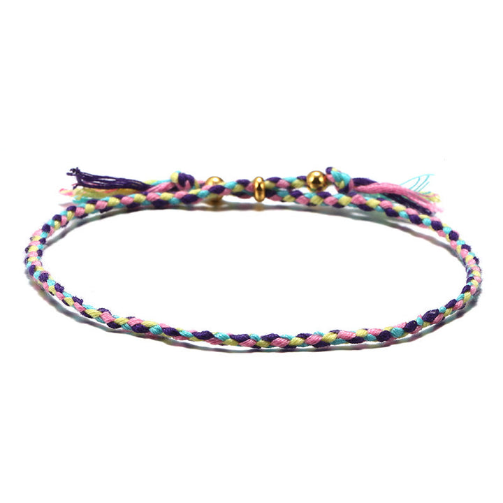 Braccialetto dell'armonia regolabile con nappa intrecciata in corda colorata fatta a mano di Buddha Stones