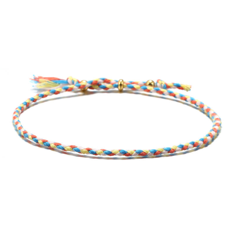 Braccialetto dell'armonia regolabile con nappa intrecciata in corda colorata fatta a mano di Buddha Stones
