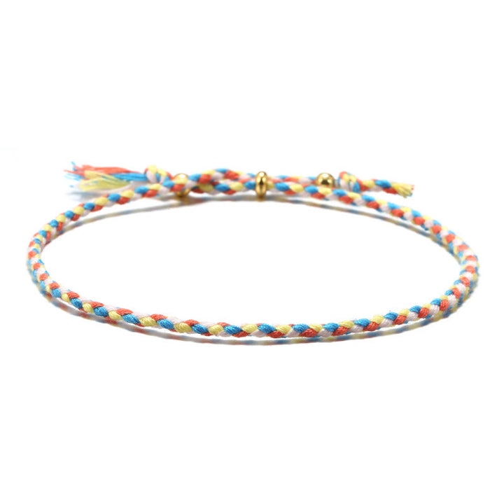 Braccialetto dell'armonia regolabile con nappa intrecciata in corda colorata fatta a mano di Buddha Stones