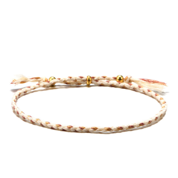 Braccialetto dell'armonia regolabile con nappa intrecciata in corda colorata fatta a mano di Buddha Stones