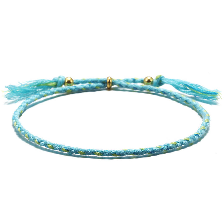 Braccialetto dell'armonia regolabile con nappa intrecciata in corda colorata fatta a mano di Buddha Stones