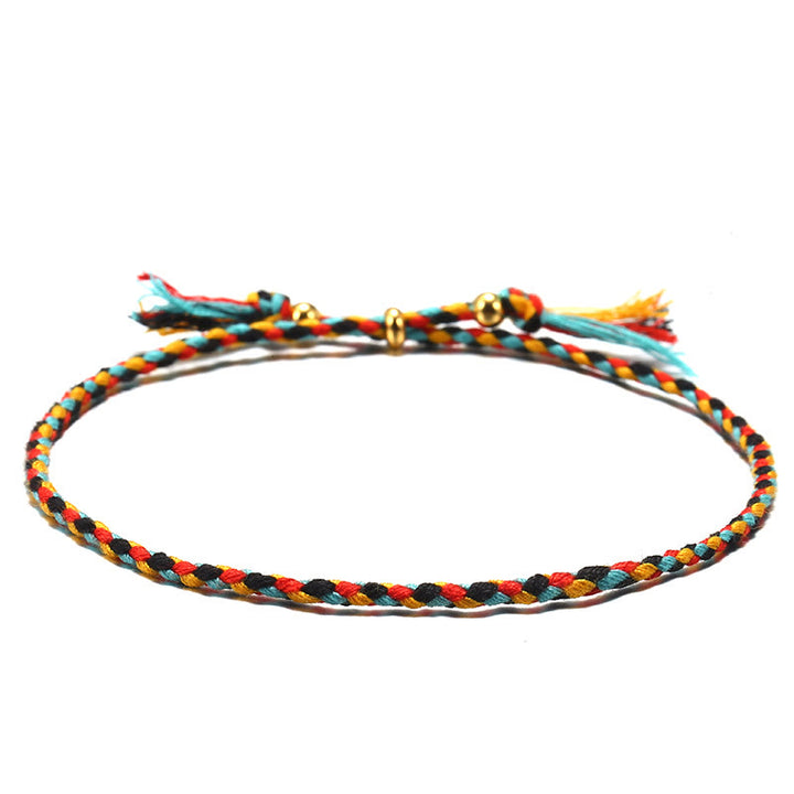 Braccialetto dell'armonia regolabile con nappa intrecciata in corda colorata fatta a mano di Buddha Stones