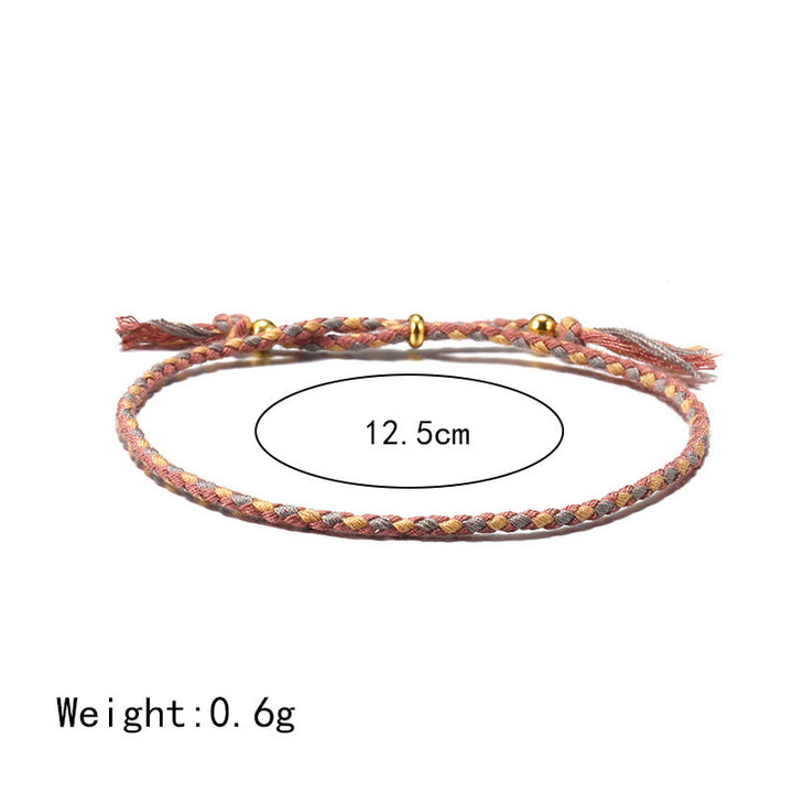 Braccialetto dell'armonia regolabile con nappa intrecciata in corda colorata fatta a mano di Buddha Stones