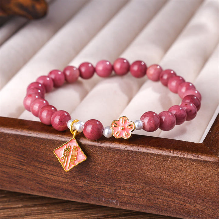 Braccialetto energetico amorevole con fiori di pesco e rodonite Buddha Stones