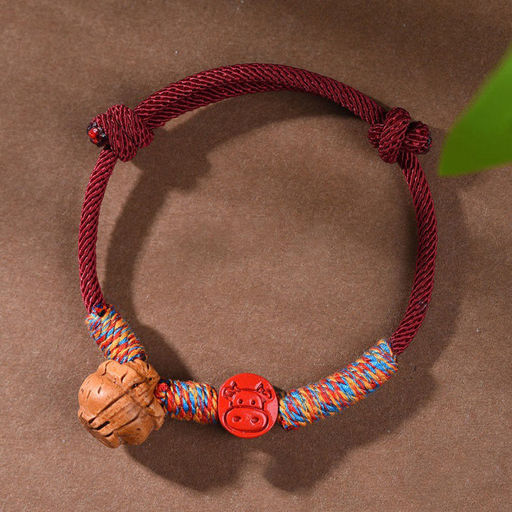 Braccialetto della fortuna fatto a mano con Buddha Stones, zodiaco cinese, filo rosso, nocciolo di pesca, cinabro
