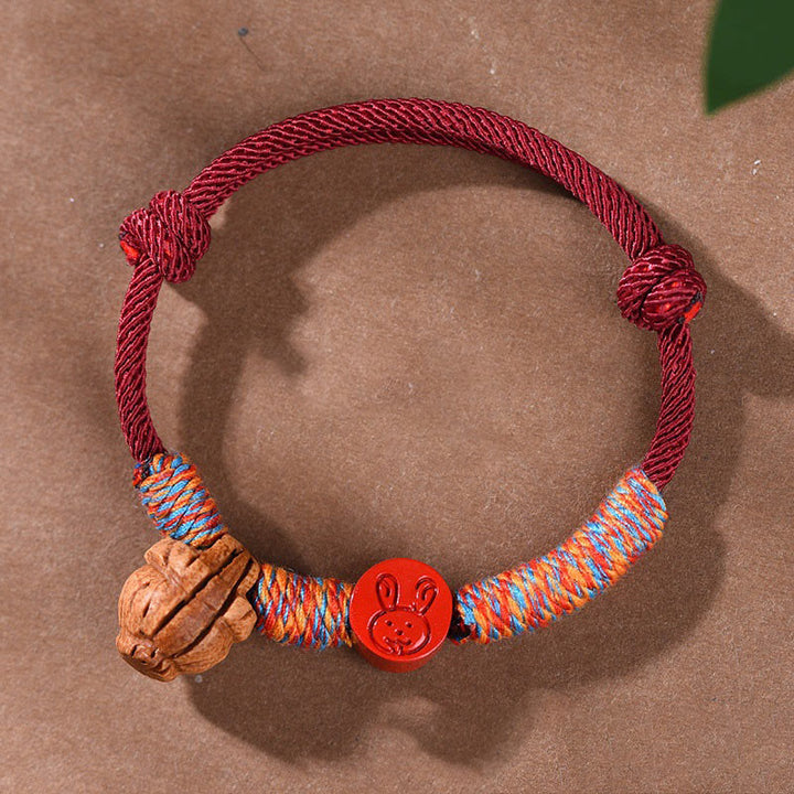 Braccialetto della fortuna fatto a mano con Buddha Stones, zodiaco cinese, filo rosso, nocciolo di pesca, cinabro