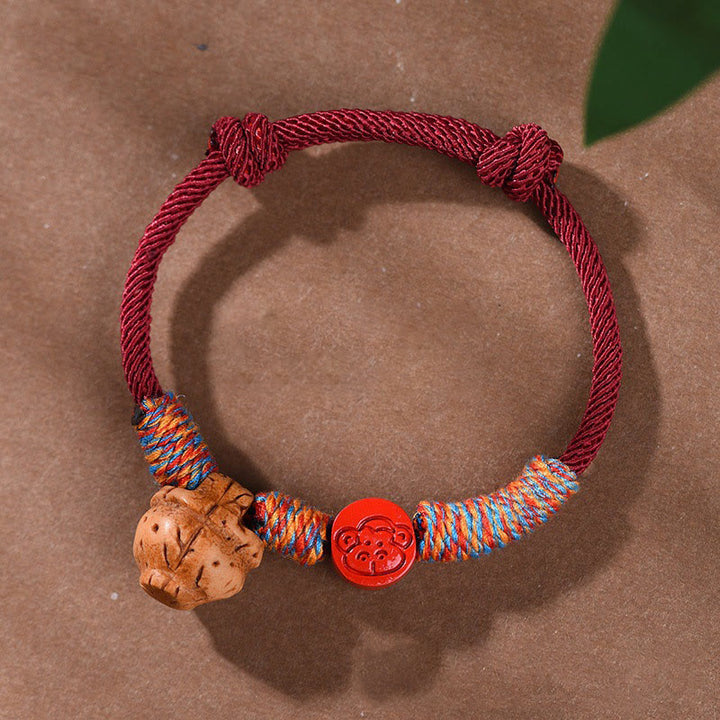 Braccialetto della fortuna fatto a mano con Buddha Stones, zodiaco cinese, filo rosso, nocciolo di pesca, cinabro