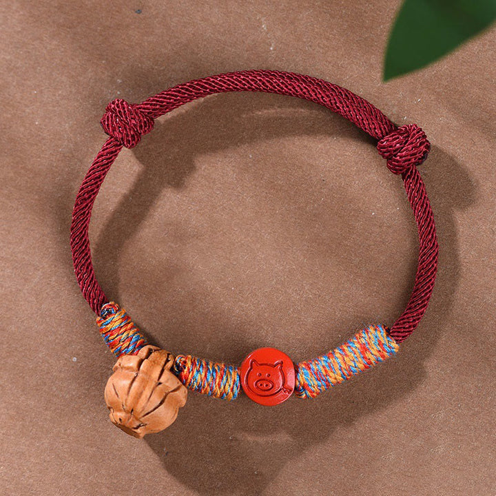 Braccialetto della fortuna fatto a mano con Buddha Stones, zodiaco cinese, filo rosso, nocciolo di pesca, cinabro