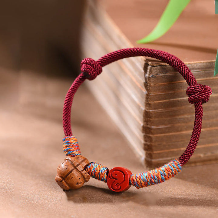 Braccialetto della fortuna fatto a mano con Buddha Stones, zodiaco cinese, filo rosso, nocciolo di pesca, cinabro