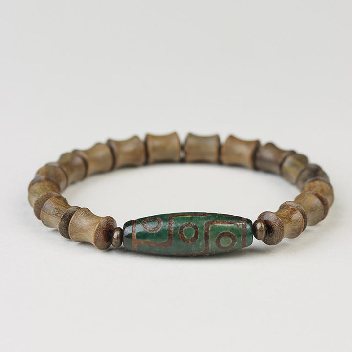 Braccialetto della pace in legno di sandalo verde con perline Dzi tibetane a nove occhi Buddha Stones