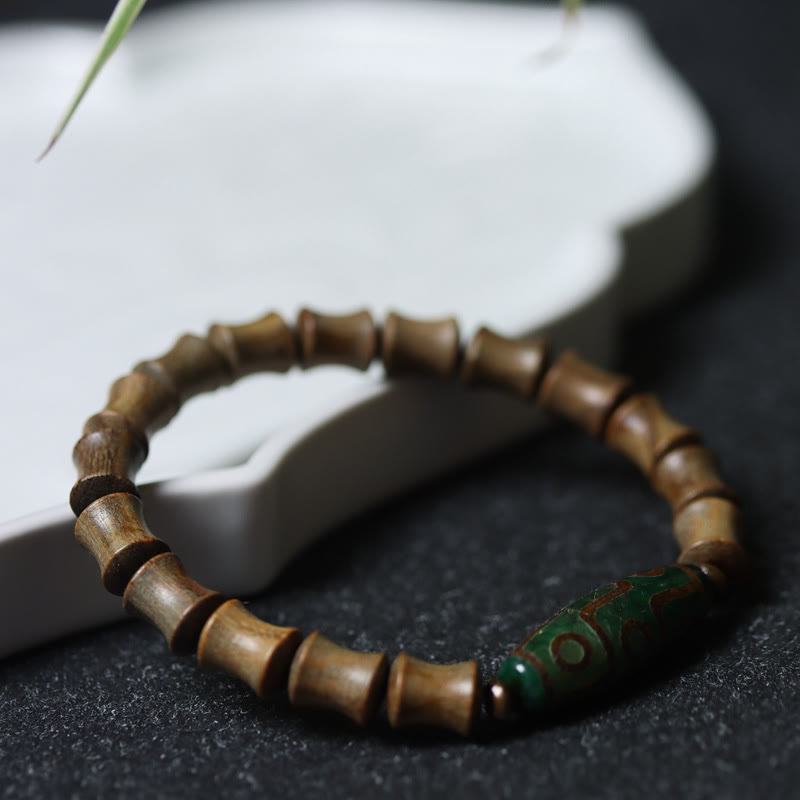 Braccialetto della pace in legno di sandalo verde con perline Dzi tibetane a nove occhi Buddha Stones