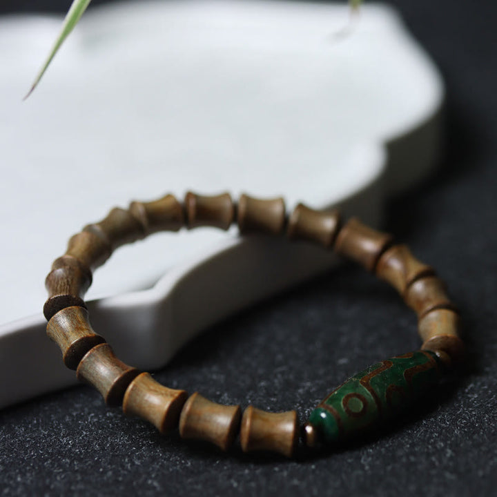 Braccialetto della pace in legno di sandalo verde con perline Dzi tibetane a nove occhi Buddha Stones