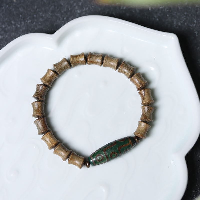 Braccialetto della pace in legno di sandalo verde con perline Dzi tibetane a nove occhi Buddha Stones