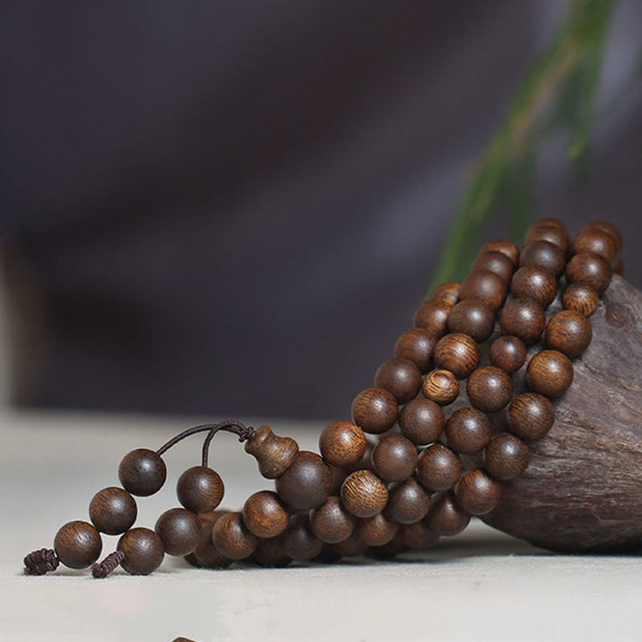 Buddha Stones Cambogia Qinan Agarwood Braccialetto di equilibrio dell'acqua che affonda a nove punti