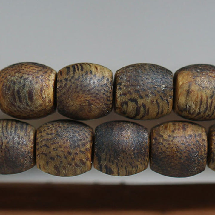 Buddha Stones 108 perline Mala da 6 mm con perline cilindriche Hainan Verde Qinan Bracciale calmo in legno di agar