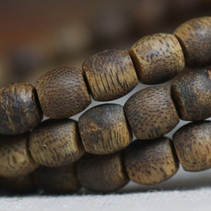 Buddha Stones 108 perline Mala da 6 mm con perline cilindriche Hainan Verde Qinan Bracciale calmo in legno di agar