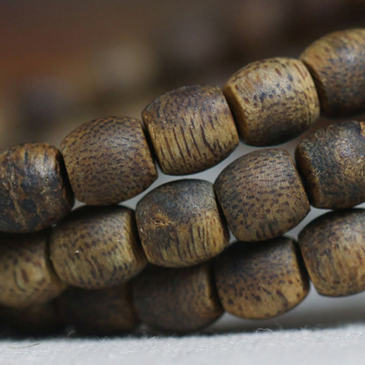 Buddha Stones 108 perline Mala da 6 mm con perline cilindriche Hainan Verde Qinan Bracciale calmo in legno di agar