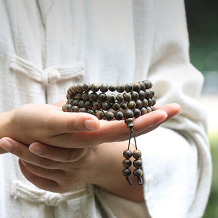 Bracciale con Buddha Stones, 108 perle di Mala, legno di agar naturale Tarakan, per allontanare gli spiriti maligni