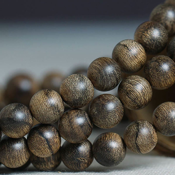 Bracciale con Buddha Stones, 108 perle di Mala, legno di agar naturale Tarakan, per allontanare gli spiriti maligni