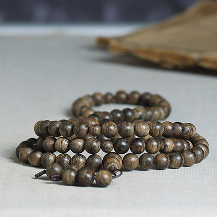Bracciale con Buddha Stones, 108 perle di Mala, legno di agar naturale Tarakan, per allontanare gli spiriti maligni