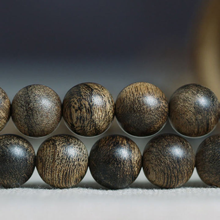 Bracciale con Buddha Stones, 108 perle di Mala, legno di agar naturale Tarakan, per allontanare gli spiriti maligni