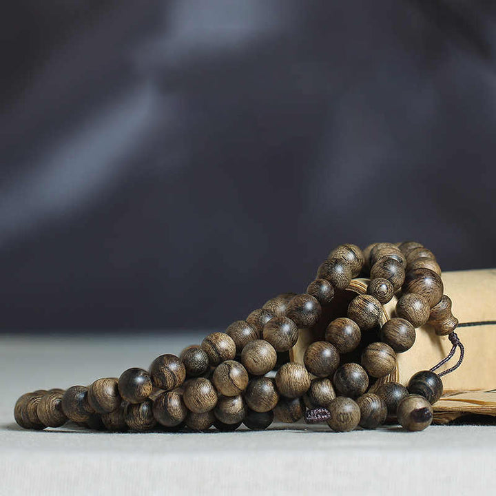 Bracciale con Buddha Stones, 108 perle di Mala, legno di agar naturale Tarakan, per allontanare gli spiriti maligni