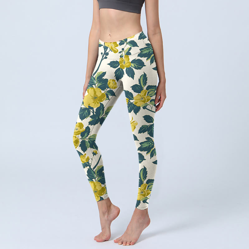 Leggings da palestra con stampa di Buddha Stones, fiori gialli, foglie verdi, pantaloni da yoga da donna - Seta di mais - US18, UK/AU22, EU50 (4XL) - image 0
