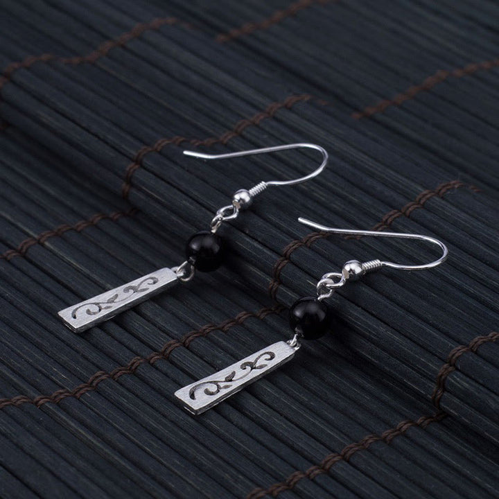 Orecchini pendenti con protezione a forma di vite cava in onice nero in argento sterling 925 Buddha Stones