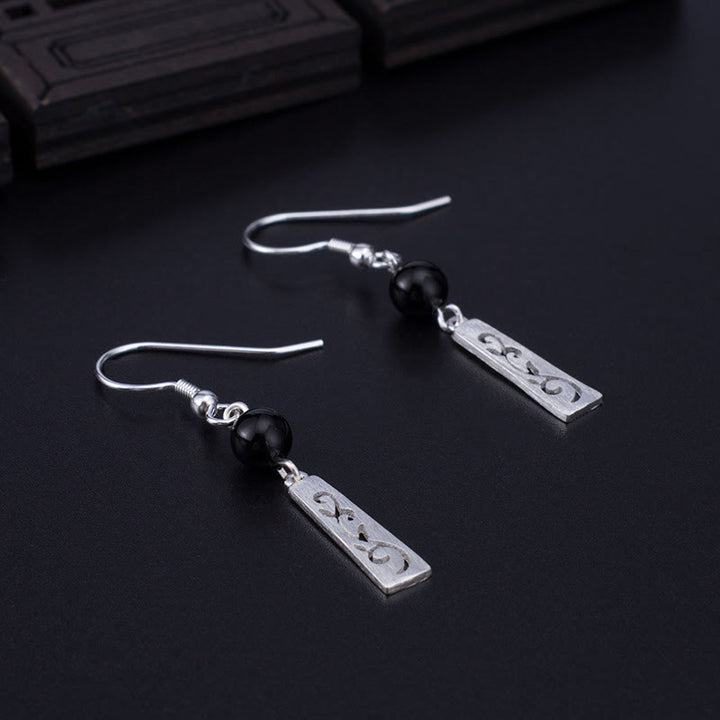 Orecchini pendenti con protezione a forma di vite cava in onice nero in argento sterling 925 Buddha Stones