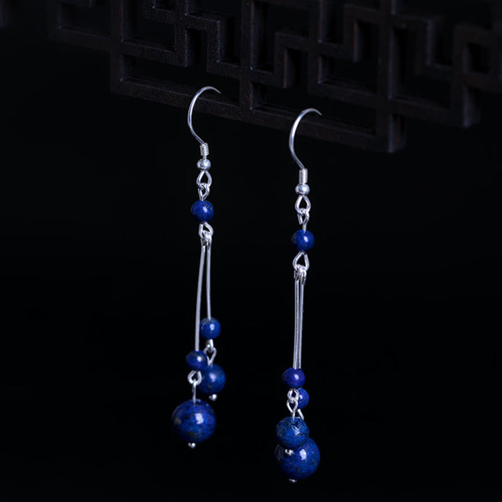 Orecchini pendenti Serenity in argento sterling 925 con perle di lazurite e pietre Buddha Stones