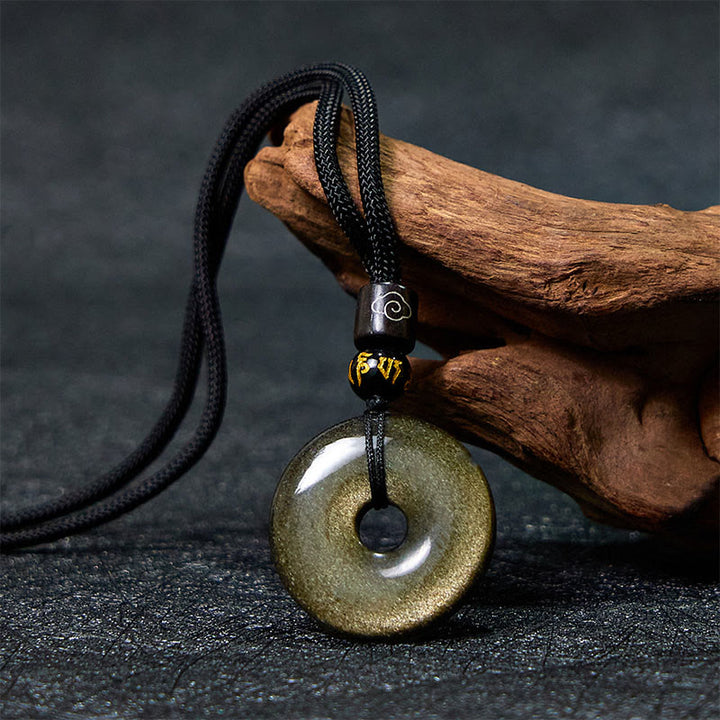 Buddha Stones Collana pendente con fibbia della pace in ossidiana naturale lucidata in oro