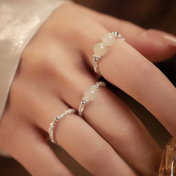 Anello elastico con perline di giada Hetian naturale in argento sterling 925 Buddha Stones