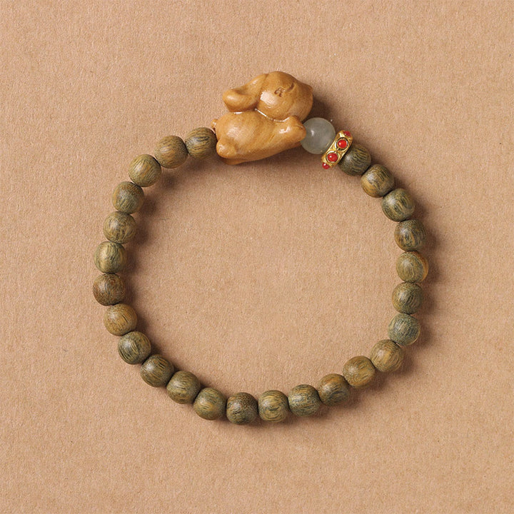 Braccialetto positivo con coniglio carino in legno di sandalo verde e oro Buddha Stones