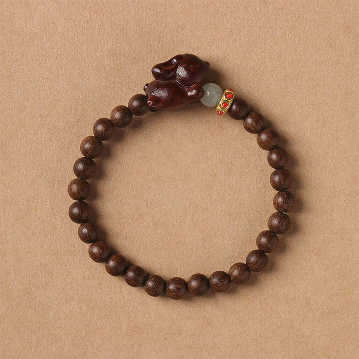 Braccialetto positivo con coniglio carino in legno di sandalo verde e oro Buddha Stones